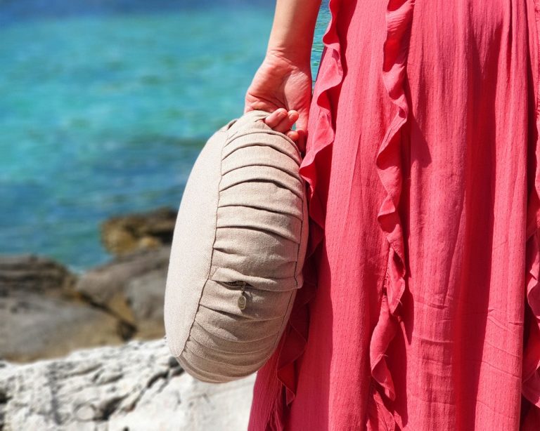 Natural meditation cushion - zafu - with a model