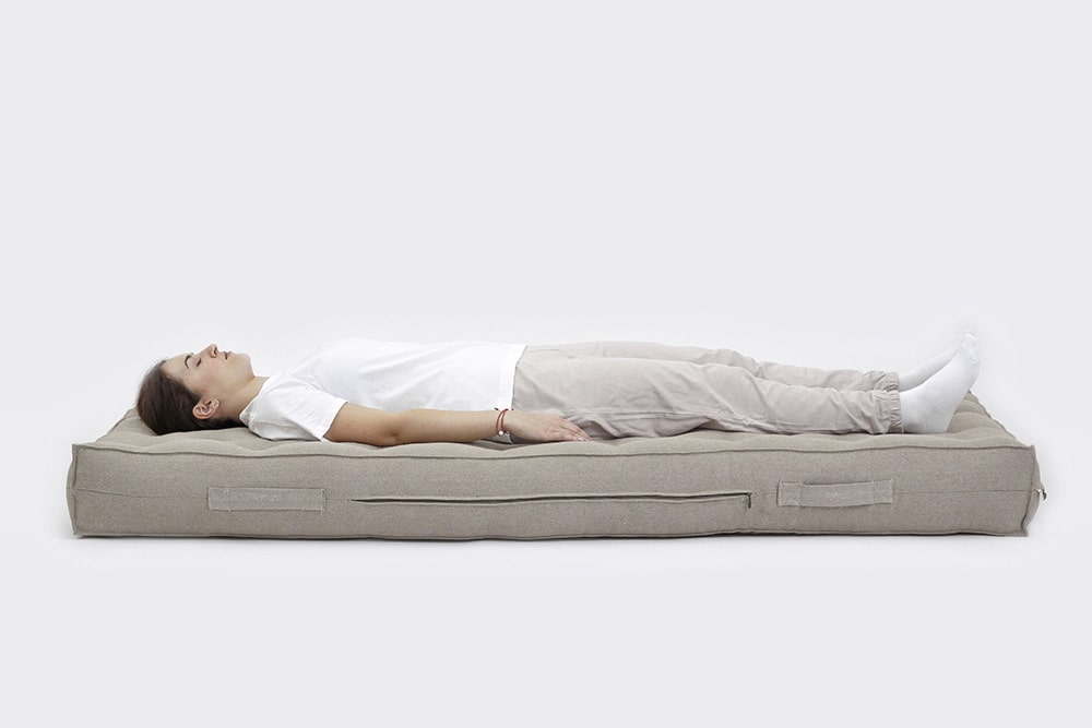 woman laying on wool mattress