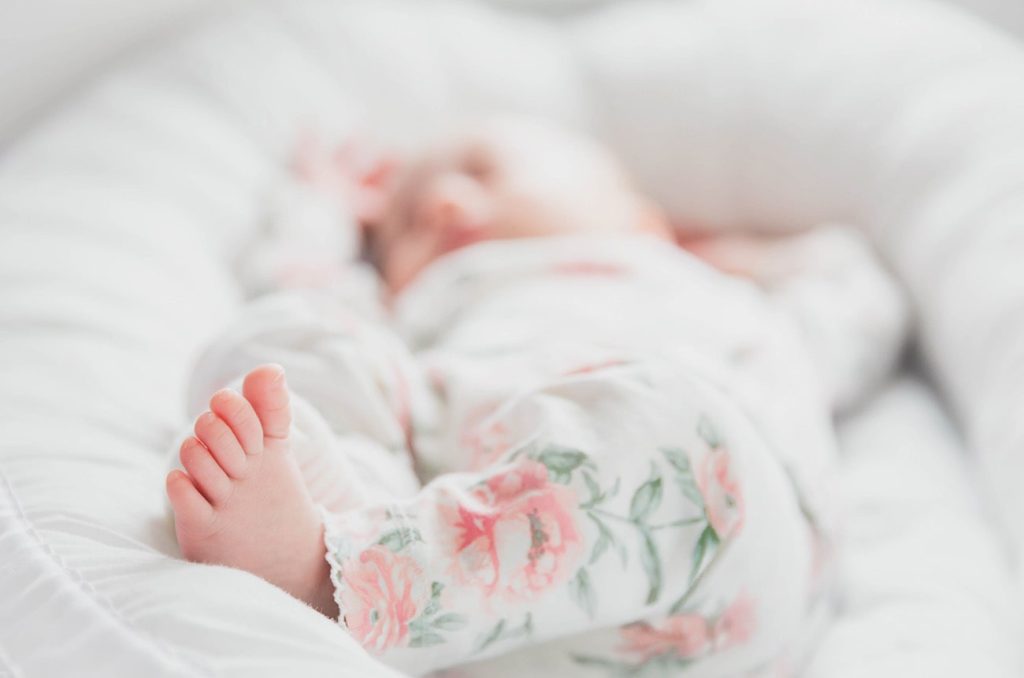 baby sleeping in a co-sleeper