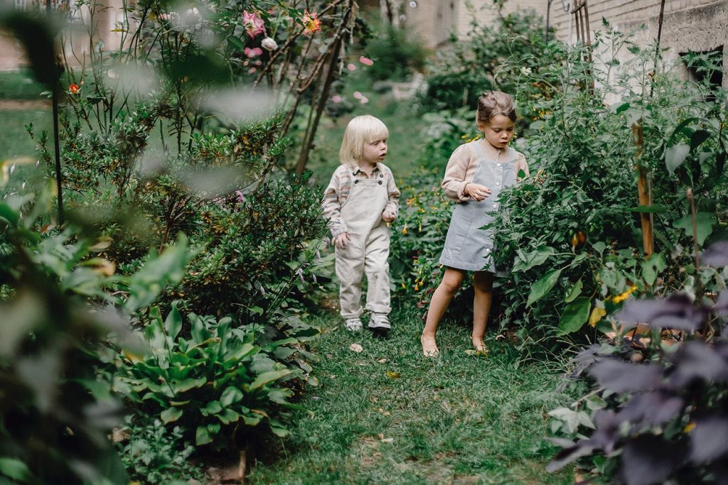 two girls in a house garden