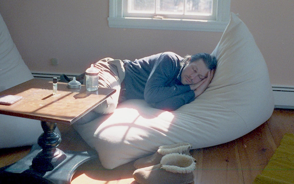 Customer Spotlight - Interview with Katherine R. - man sleeping on triangle bean bag